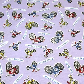 Cotton Jersey T-Shirt Knit, Bike Fabric with Bicycles and Tricycle on Lavendar Background. 2-way stretch. Sold by the 1/2 yard